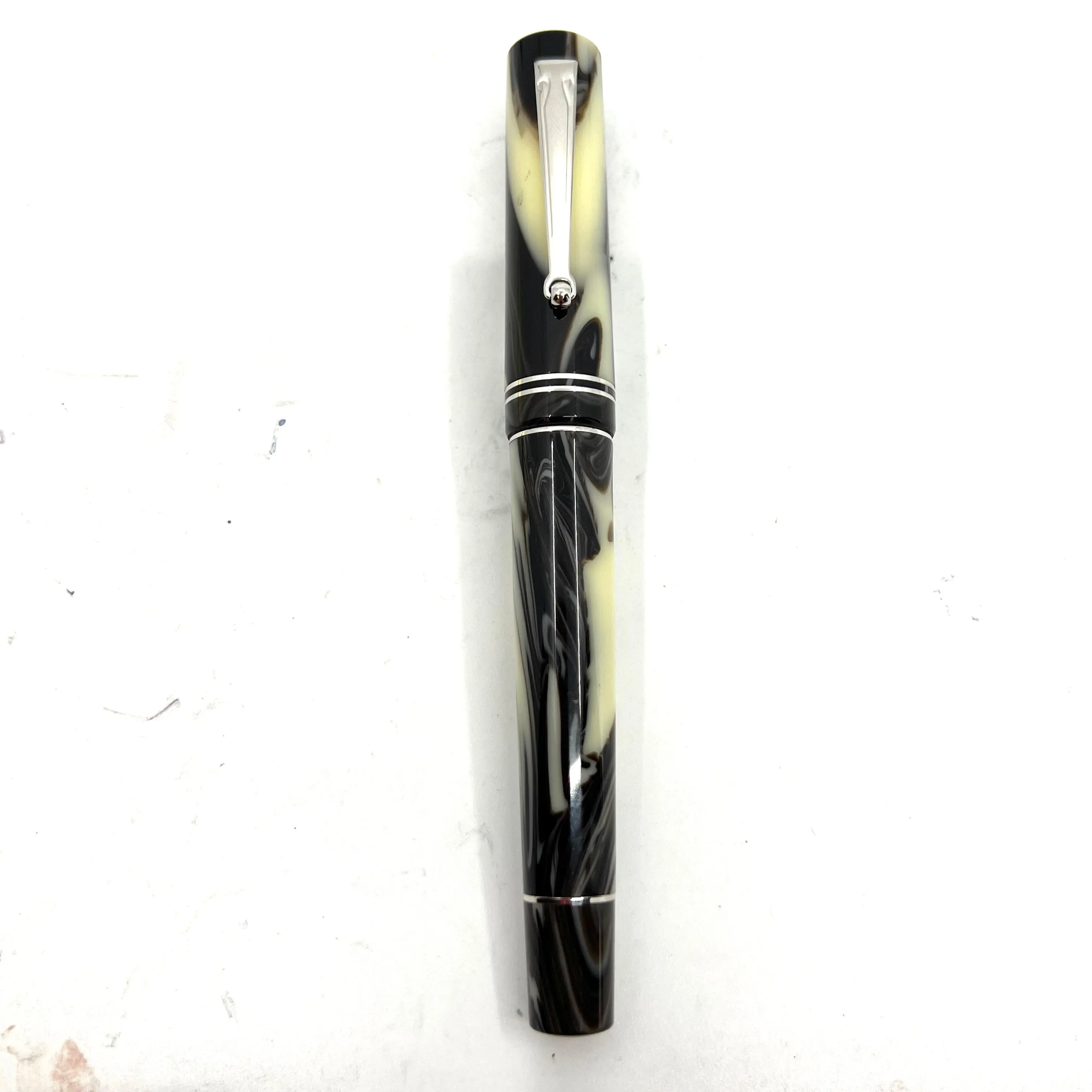 Delta "The Journal" Fountain Pen -Ivory Backdrop with Black/Brown Swirls