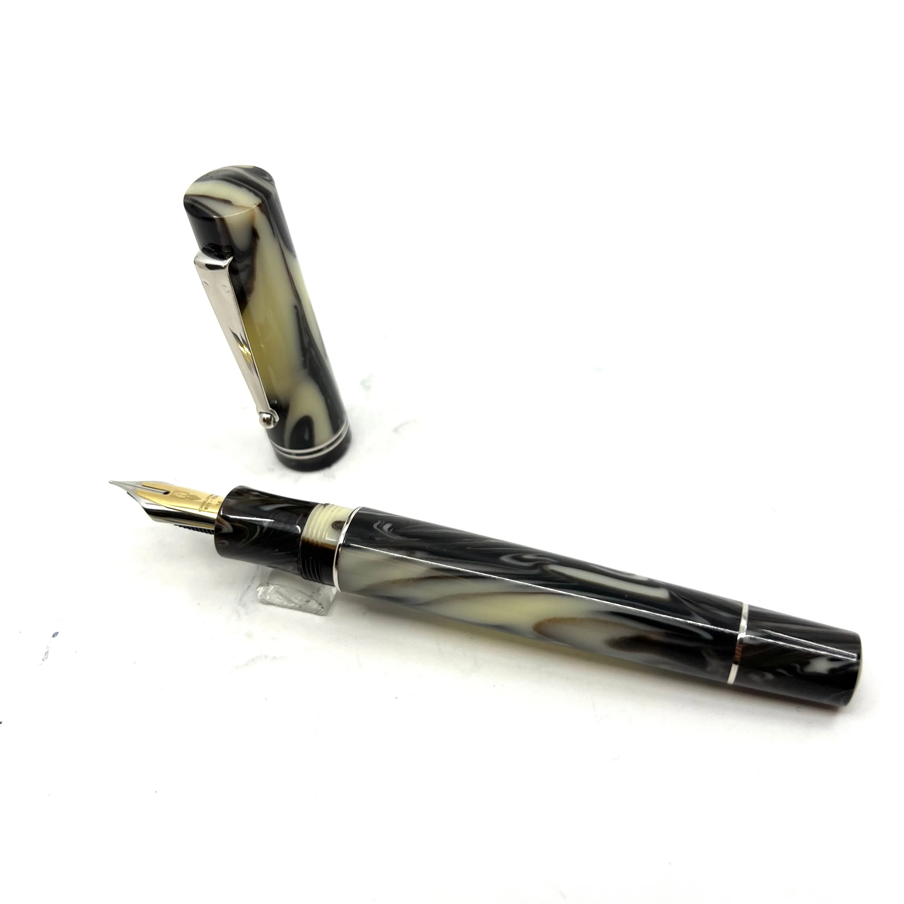 Delta "The Journal" Fountain Pen -Ivory Backdrop with Black/Brown Swirls